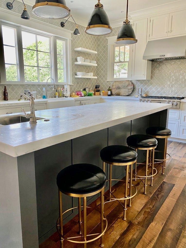 Painted island with brass stools